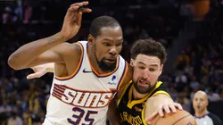 Kevin Durant #35 of the Phoenix Suns and Klay Thompson #11 of the Golden State Warriors compete the ball in the fourth quarter at Chase Center on February 10, 2024 in San Francisco, California.