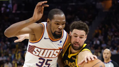 Kevin Durant #35 of the Phoenix Suns and Klay Thompson #11 of the Golden State Warriors compete the ball in the fourth quarter at Chase Center on February 10, 2024 in San Francisco, California.