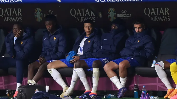 Kylian Mbappe of France sits on the bench after being substituted during the UEFA EURO 2024 quarter-final match between Portugal and France.