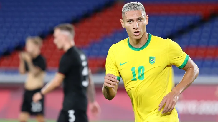Richarlison #10 of Brazil celebrates after scoring their side's second goal during the Men's First Round Group D match between Brazil and Germany
