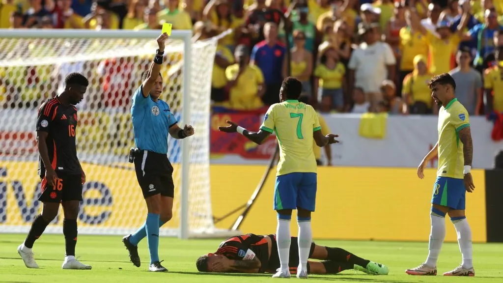 Vinicius Junior of Brazil reacts after receiving a yellow card during the CONMEBOL Copa America 2024 Group D match between Brazil and Colombia. Ezra Shaw/Getty Images