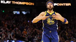 Klay Thompson #11 of the Golden State Warriors celebrates his three-point shot against the Memphis Grizzlies in the fourth quarter in Game Six of the 2022 NBA Playoffs Western Conference Semifinals.