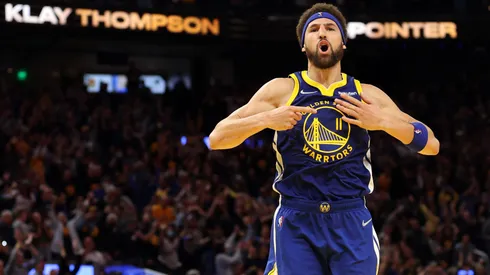 Klay Thompson #11 of the Golden State Warriors celebrates his three-point shot against the Memphis Grizzlies in the fourth quarter in Game Six of the 2022 NBA Playoffs Western Conference Semifinals.
