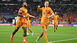 Memphis Depay (L) and Frenkie de Jong of Netherlands celebrate their team's second goal by Davy Klaassen during the FIFA World Cup Qatar 2022