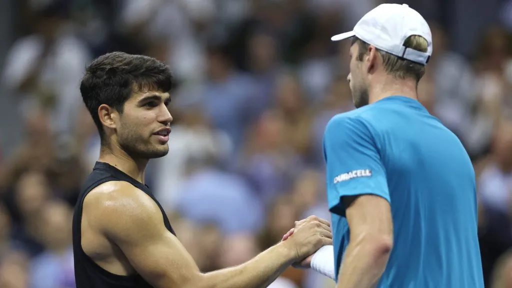 Botic van De Zandschulp of the Netherlands shakes hands with Carlos Alcaraz of Spain after winning in second round. Matthew Stockman/Getty Images