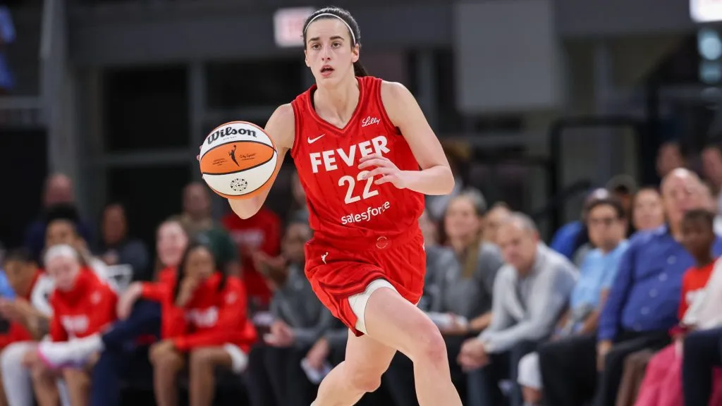 Caitlin Clark #22 of the Indiana Fever brings the ball up court during the game against the Chicago Sky. Michael Hickey/Getty Images