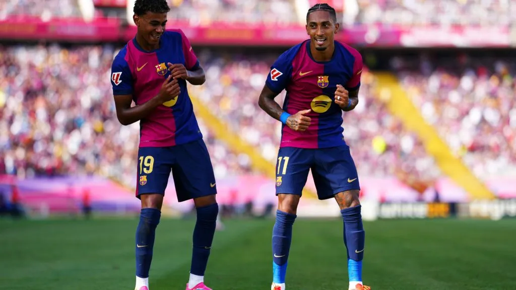 Raphinha of FC Barcelona celebrates scoring his team’s first goal with team mate Lamine Yamal during the La Liga match between FC Barcelona and Real Valladolid CF at Camp Nou on August 31, 2024 in Barcelona, Spain.