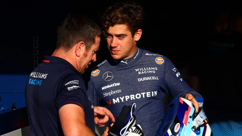 Franco Colapinto of Argentina and Williams talks with a Williams team member in the Paddock during previews ahead of the F1 Grand Prix of Italy at Autodromo Nazionale Monza on August 29, 2024 in Monza, Italy. (Photo by Clive Rose/Getty Images)
