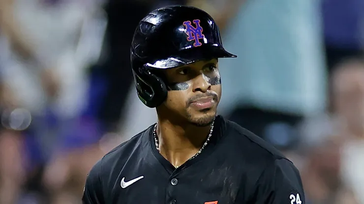 Francisco Lindor #12 of the New York Mets reacts as he watches a three-run home run by Brandon Nimmo #9 of the New York Mets during the fourth inning against the Miami Marlins at Citi Field.