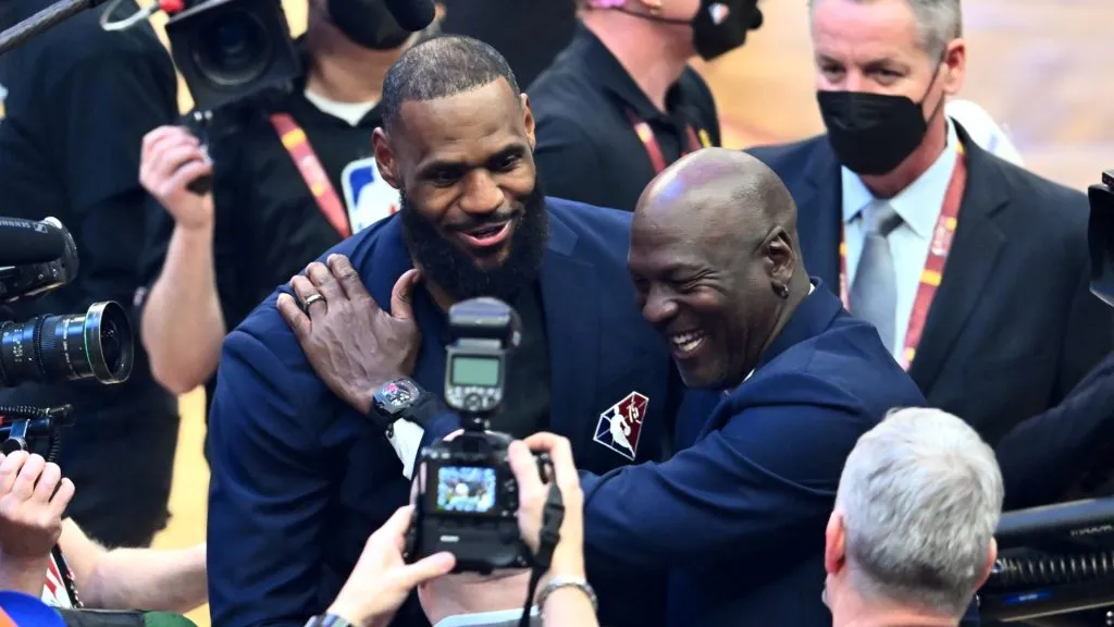 Michael Jordan and LeBron James hug after the presentation of the NBA 75th Anniversary Team during the 2022 NBA All-Star Game at Rocket Mortgage Fieldhouse on February 20, 2022 in Cleveland, Ohio. (Photo by Jason Miller/Getty Images)