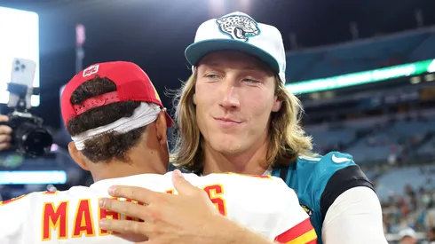 Trevor Lawrence #16 of the Jacksonville Jaguars hugs Patrick Mahomes #15 of the Kansas City Chiefs after a preseason game at EverBank Stadium on August 10, 2024 in Jacksonville, Florida.