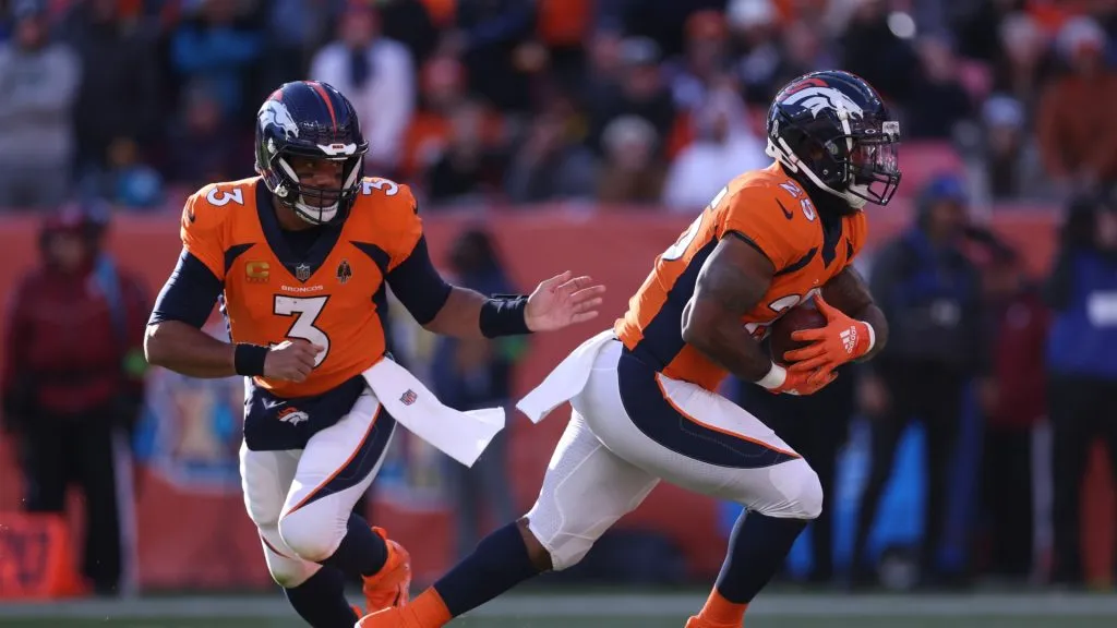 Samaje Perine #25 of the Denver Broncos carries the ball for a touchdown in the first quarter of the game against the Cleveland Browns at Empower Field At Mile High on November 26, 2023 in Denver, Colorado.