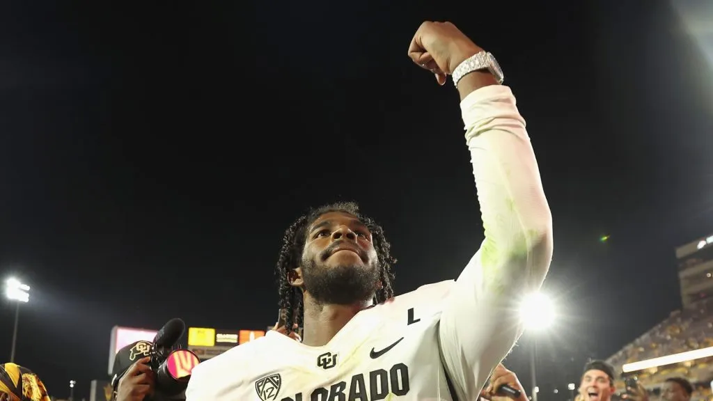 Quarterback Shedeur Sanders #2 of the Colorado Buffaloes celebrates as he walks off the field following the NCAAF game against the Arizona State Sun Devils at Mountain America Stadium on October 07, 2023 in Tempe, Arizona. The Buffaloes defeated the Sun Devils 27-24.