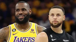 LeBron James #6 of the Los Angeles Lakers stands next to Stephen Curry #30 of the Golden State Warriors.