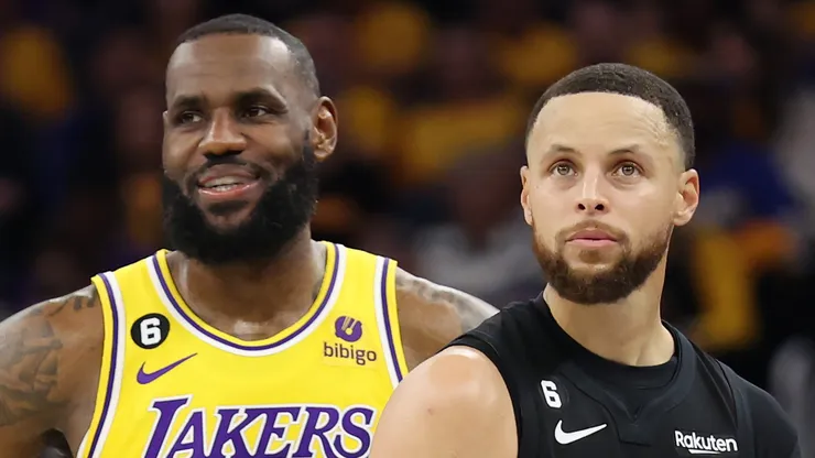 LeBron James #6 of the Los Angeles Lakers stands next to Stephen Curry #30 of the Golden State Warriors.