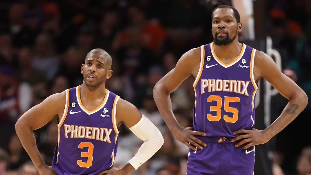 Chris Paul #3 and Kevin Durant #35 of the Phoenix Suns stand on the court during a timeout form the second half of the NBA game against the Minnesota Timberwolves at Footprint Center on March 29, 2023 in Phoenix, Arizona.