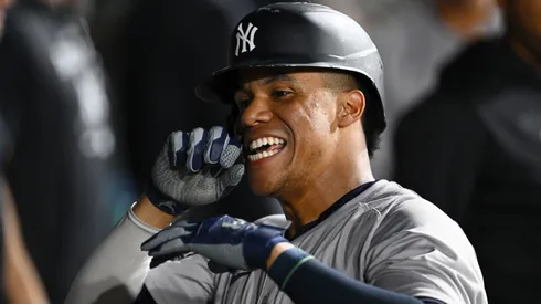 Juan Soto #22 of the New York Yankees celebrates his solo home run in the seventh inning against the Chicago White Sox at Guaranteed Rate Field.