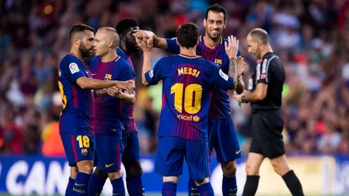 Lionel Messi celebrating with his teammates at FC Barcelona.