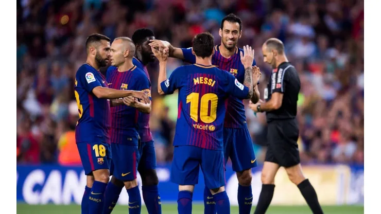 Lionel Messi celebrating with his teammates at FC Barcelona.