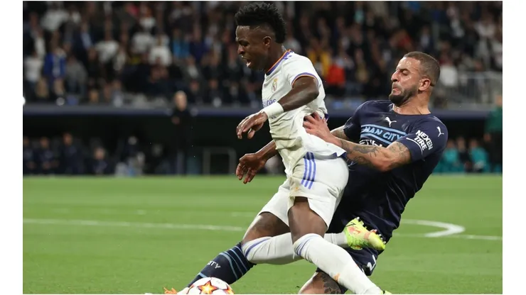 Kyle Walker of Manchester City FC tackles Vinicius Junior (L) of Real Madrid CF