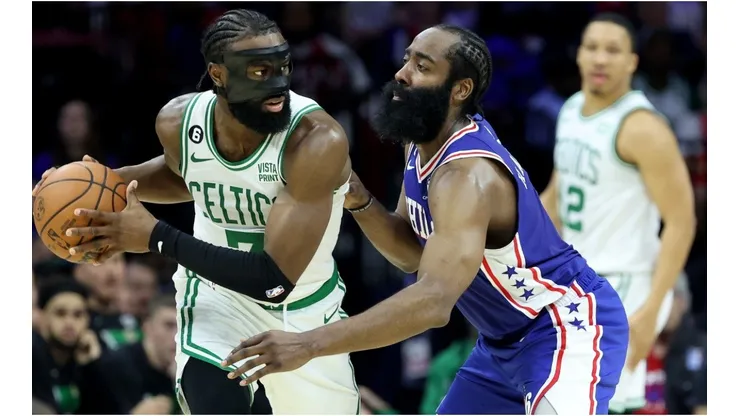 Jaylen Brown #7 of the Boston Celtics looks to pass against James Harden #1 of the Philadelphia 76ers