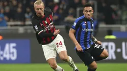 Simon Kjaer of AC Milan competes for the ball with Lautaro Martinez of FC Internazionale