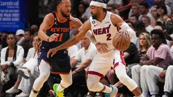 Gabe Vincent #2 of the Miami Heat dribbles the basketball while being defended by Jalen Brunson #11 of the New York Knicks
