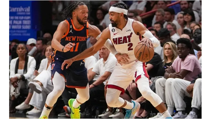 Gabe Vincent #2 of the Miami Heat dribbles the basketball while being defended by Jalen Brunson #11 of the New York Knicks