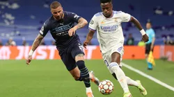 Vinicius Junior (R) of Real Madrid CF competes for the ball with Kyle Walker (L) of Manchester City FC