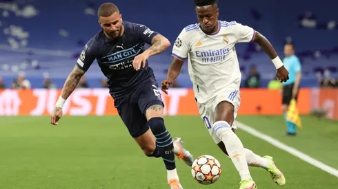 Vinicius Junior (R) of Real Madrid CF competes for the ball with Kyle Walker (L) of Manchester City FC