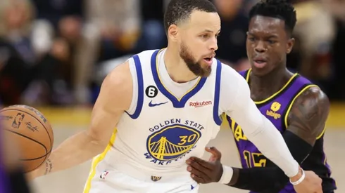 Stephen Curry #30 of the Golden State Warriors controls the ball ahead of Dennis Schroder #17 of the Los Angeles Lakers