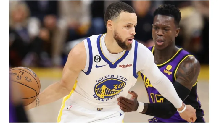 Stephen Curry #30 of the Golden State Warriors controls the ball ahead of Dennis Schroder #17 of the Los Angeles Lakers