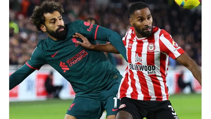 Mohamed Salah of Liverpool and Rico Henry of Brentford