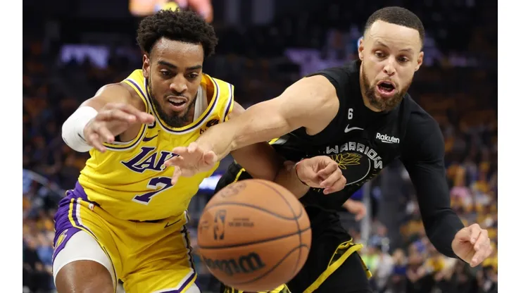 Troy Brown Jr. of the Los Angeles Lakers and Stephen Curry of the Golden State Warriors