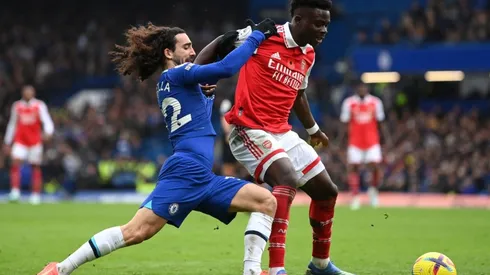 Bukayo Saka of Arsenal holds off Marc Cucurella of Chelsea