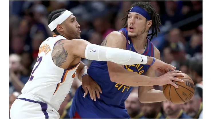 Aaron Gordon #50 of the Denver Nuggets is guarded by Ish Wainright #12 of the Phoenix Suns