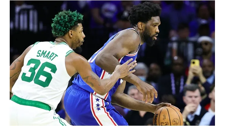 Joel Embiid #21 of the Philadelphia 76ers drives past Marcus Smart #36 of the Boston Celtics