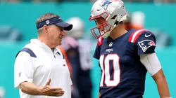 Bill Belichick (left) talking with Mac Jones - New England Patriots - NFL 2022