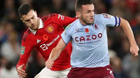 John McGinn of Aston Villa and Diogo Dalot of Manchester United