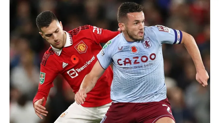 John McGinn of Aston Villa and Diogo Dalot of Manchester United