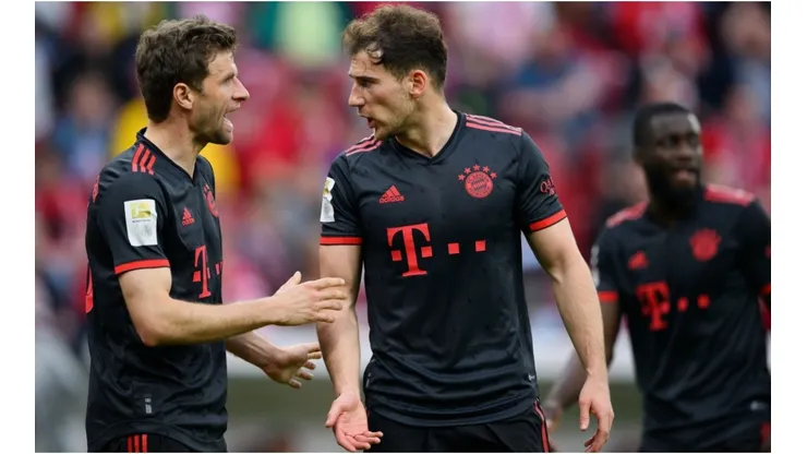 Thomas Mueller of Bayern Munich discusses with Leon Goretzka