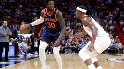 Julius Randle #30 of the New York Knicks dribbles the ball against Jimmy Butler #22 of the Miami Heat