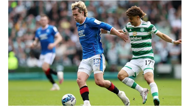 Todd Cantwell of Rangers FC is put under pressure by Jota of Celtic