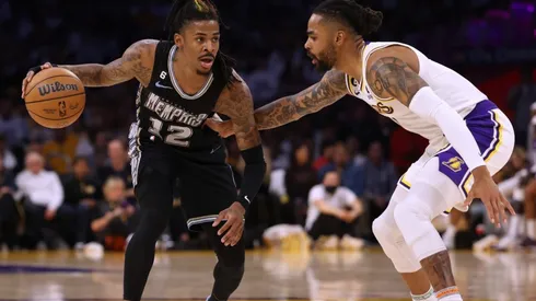 Ja Morant #12 of the Memphis Grizzlies dribbles in front of D'Angelo Russell #1 of the Los Angeles Lakers