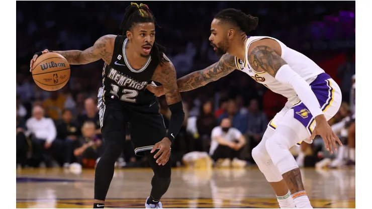 Ja Morant #12 of the Memphis Grizzlies dribbles in front of D'Angelo Russell #1 of the Los Angeles Lakers