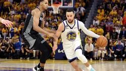 Stephen Curry #30 of the Golden State Warriors is guarded by Keegan Murray #13 of the Sacramento Kings