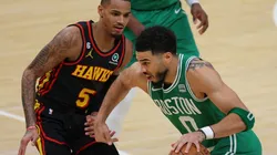 Jayson Tatum #0 of the Boston Celtics drives against Dejounte Murray #5 of the Atlanta Hawks