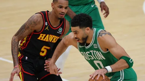 Jayson Tatum #0 of the Boston Celtics drives against Dejounte Murray #5 of the Atlanta Hawks
