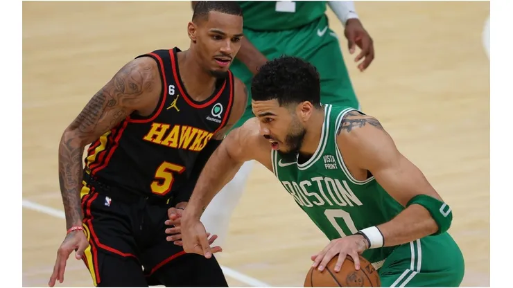 Jayson Tatum #0 of the Boston Celtics drives against Dejounte Murray #5 of the Atlanta Hawks