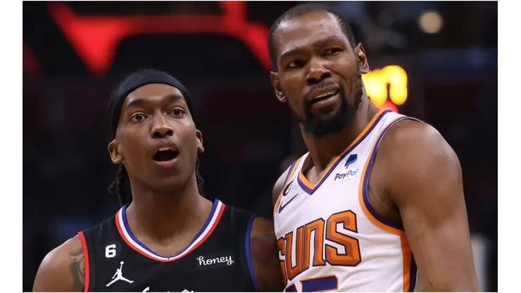 Terance Mann #14 of the LA Clippers and Kevin Durant #35 of the Phoenix Suns